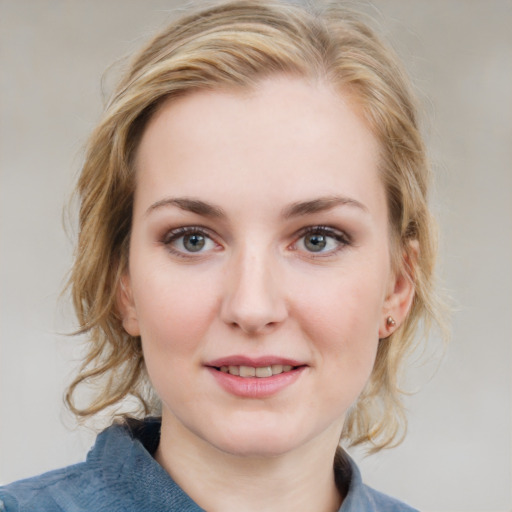 Joyful white young-adult female with medium  brown hair and blue eyes