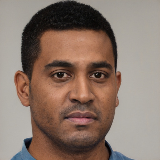 Neutral black young-adult male with short  black hair and brown eyes