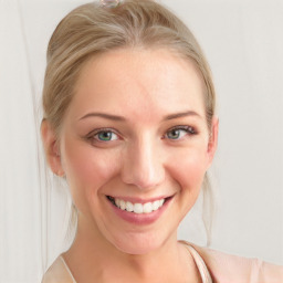 Joyful white young-adult female with medium  brown hair and blue eyes