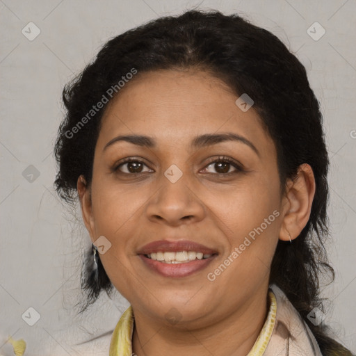 Joyful latino adult female with medium  brown hair and brown eyes