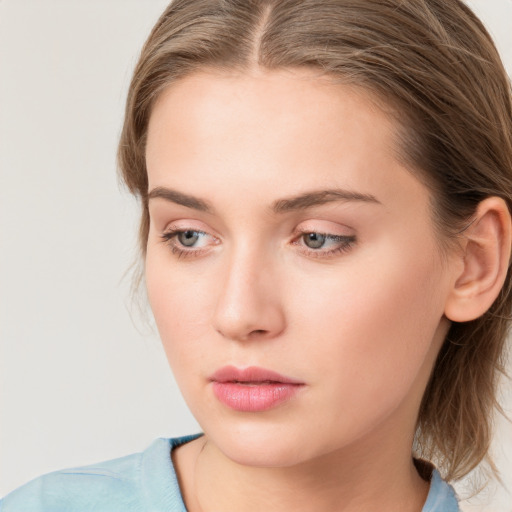 Neutral white young-adult female with medium  brown hair and grey eyes