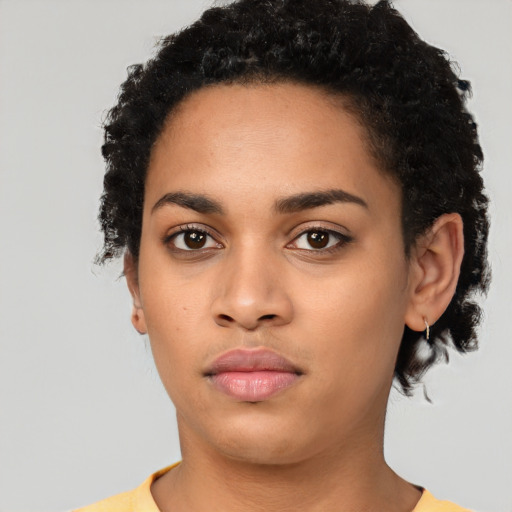 Neutral latino young-adult female with short  black hair and brown eyes