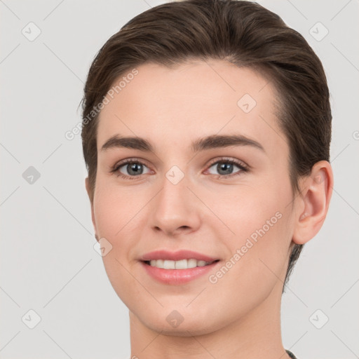 Joyful white young-adult female with short  brown hair and brown eyes