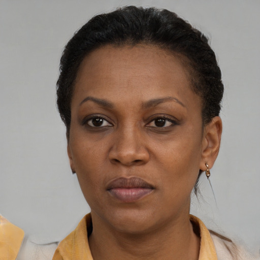 Neutral black adult female with short  black hair and brown eyes