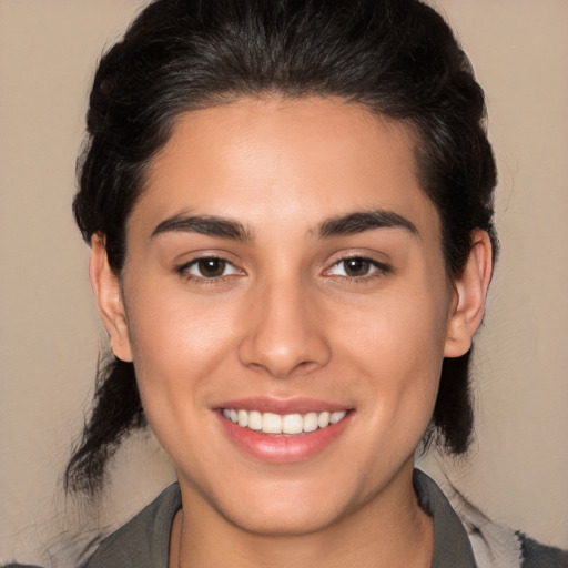 Joyful white young-adult female with medium  brown hair and brown eyes