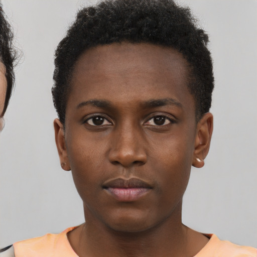 Neutral black young-adult male with short  brown hair and brown eyes
