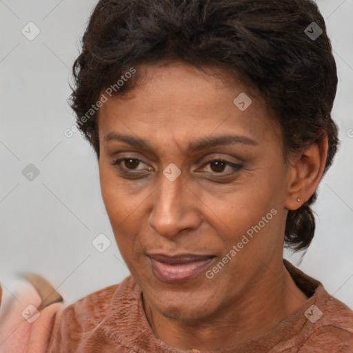 Joyful latino adult female with short  brown hair and brown eyes