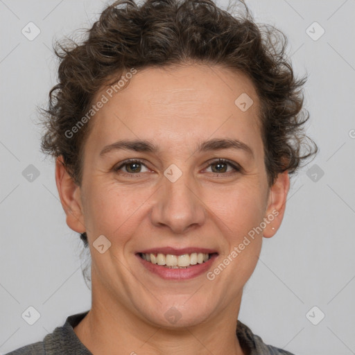 Joyful white adult female with short  brown hair and brown eyes