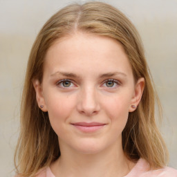 Joyful white young-adult female with medium  brown hair and blue eyes