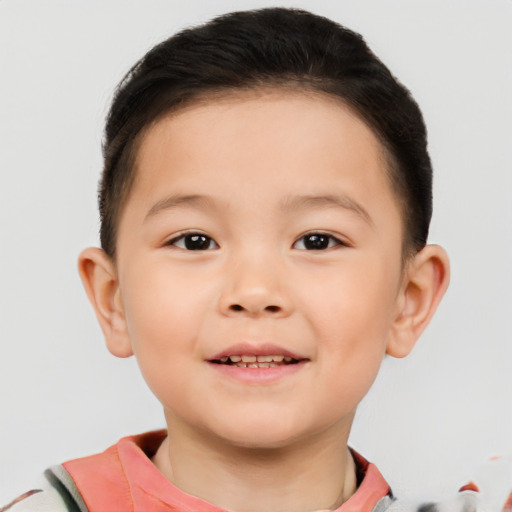 Joyful asian child male with short  brown hair and brown eyes