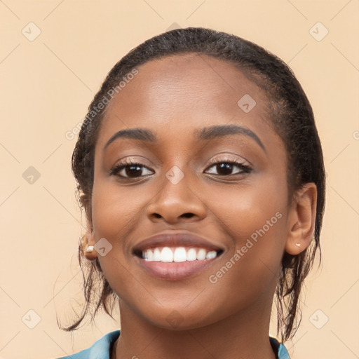 Joyful black young-adult female with medium  brown hair and brown eyes