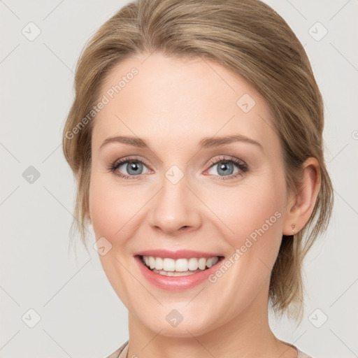 Joyful white young-adult female with medium  brown hair and blue eyes