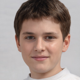 Joyful white child male with short  brown hair and brown eyes