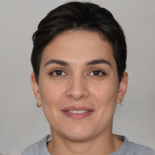 Joyful white young-adult female with short  brown hair and brown eyes