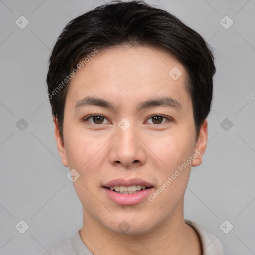 Joyful asian young-adult male with short  brown hair and brown eyes