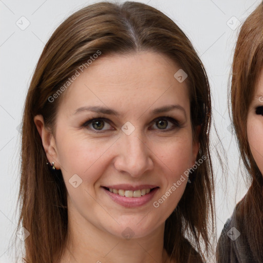 Joyful white young-adult female with long  brown hair and brown eyes