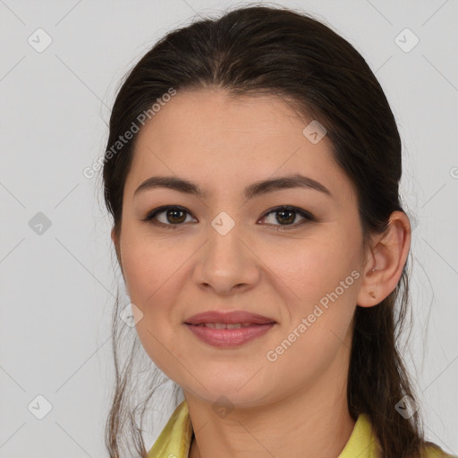 Joyful white young-adult female with long  brown hair and brown eyes