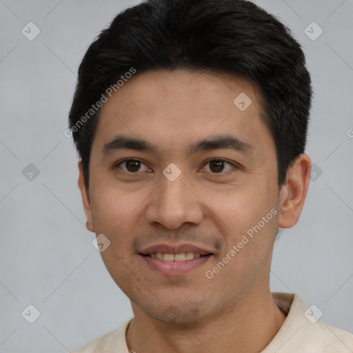 Joyful white young-adult male with short  black hair and brown eyes