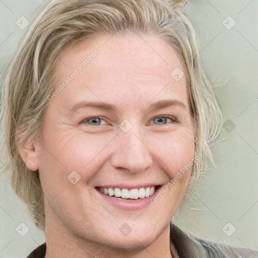 Joyful white young-adult female with medium  brown hair and blue eyes