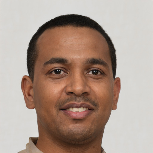 Neutral black young-adult male with short  black hair and brown eyes
