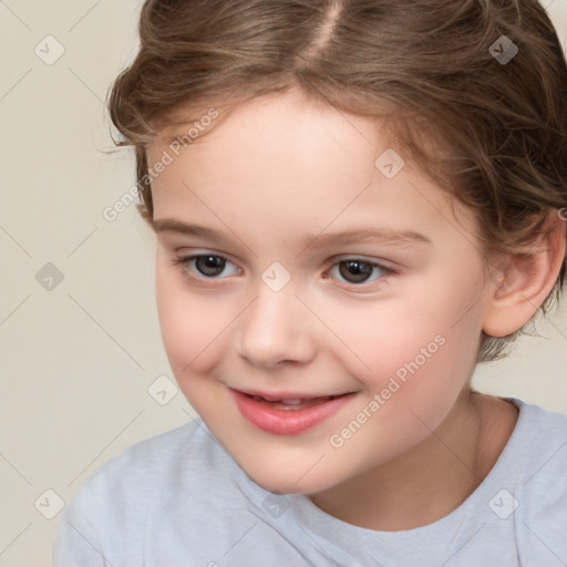 Joyful white child female with short  brown hair and brown eyes