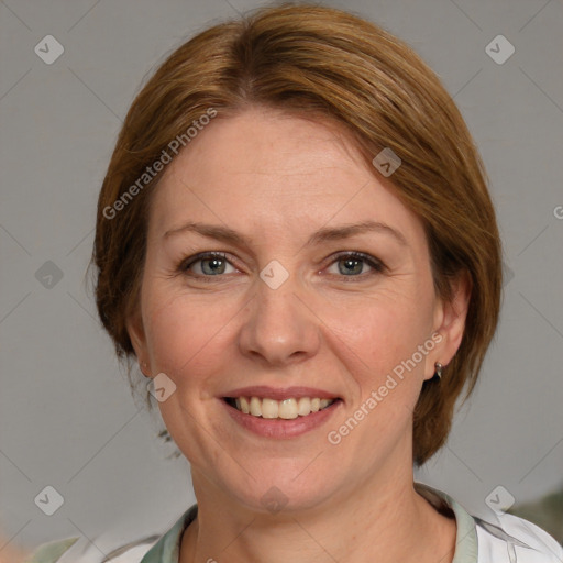 Joyful white adult female with medium  brown hair and blue eyes