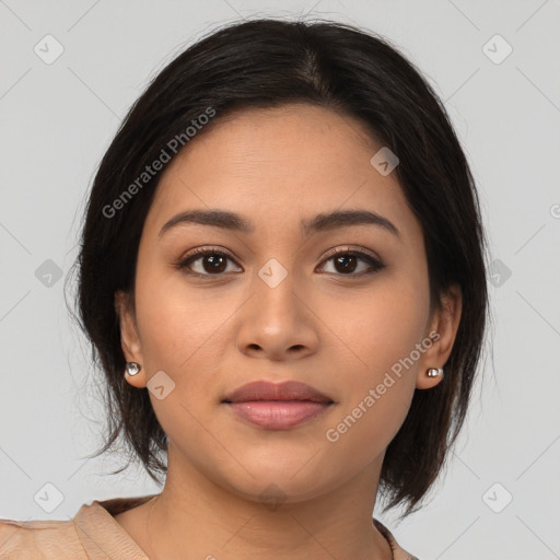 Joyful latino young-adult female with medium  brown hair and brown eyes