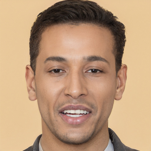 Joyful white young-adult male with short  brown hair and brown eyes