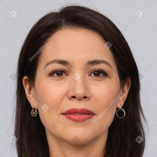 Joyful white adult female with long  brown hair and brown eyes