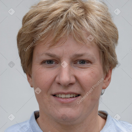 Joyful white adult female with short  brown hair and grey eyes