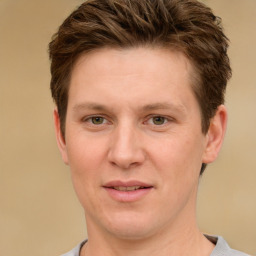 Joyful white adult male with short  brown hair and grey eyes