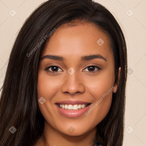 Joyful latino young-adult female with long  brown hair and brown eyes