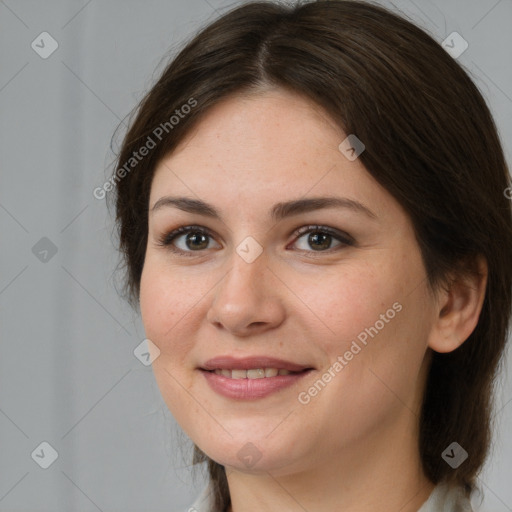 Joyful white young-adult female with medium  brown hair and brown eyes