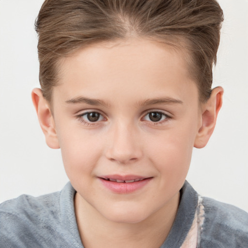 Joyful white child female with short  brown hair and brown eyes