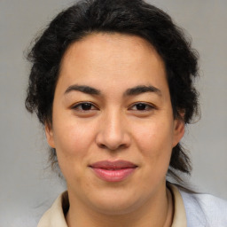 Joyful asian young-adult female with medium  brown hair and brown eyes