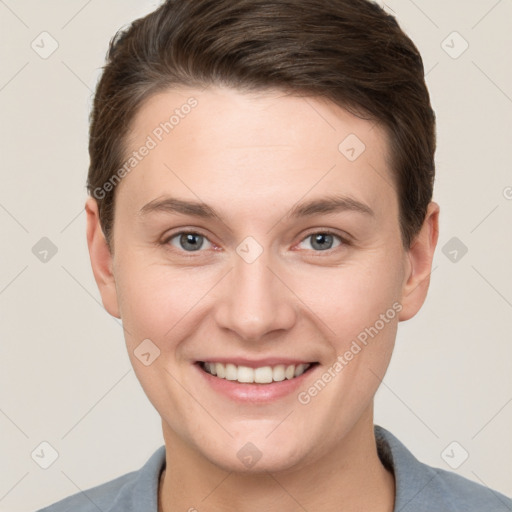 Joyful white young-adult female with short  brown hair and grey eyes