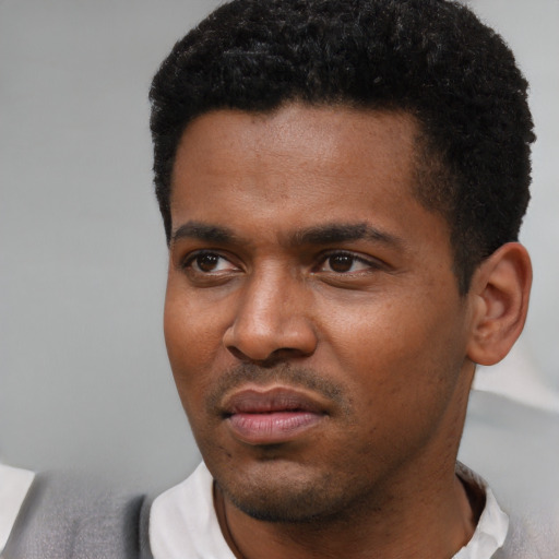 Neutral black young-adult male with short  black hair and brown eyes