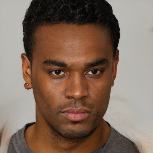 Neutral black young-adult male with short  brown hair and brown eyes
