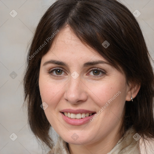 Joyful white adult female with medium  brown hair and brown eyes