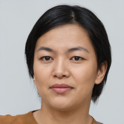 Joyful asian young-adult female with short  black hair and brown eyes