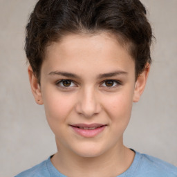 Joyful white child female with short  brown hair and brown eyes