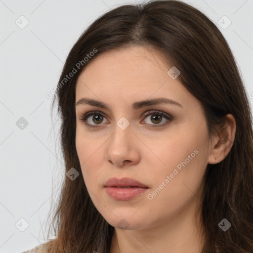 Neutral white young-adult female with long  brown hair and brown eyes