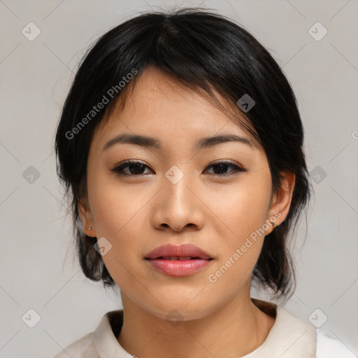 Joyful asian young-adult female with medium  black hair and brown eyes