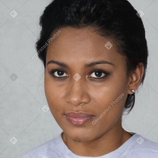 Joyful black young-adult female with short  brown hair and brown eyes