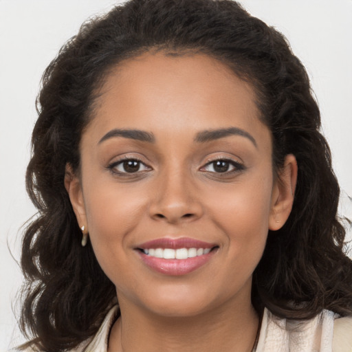 Joyful white young-adult female with long  brown hair and brown eyes