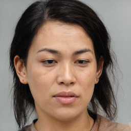 Neutral asian young-adult female with medium  brown hair and brown eyes