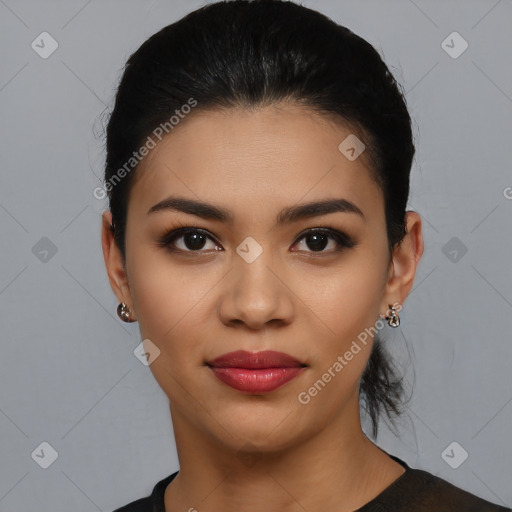 Joyful latino young-adult female with short  black hair and brown eyes