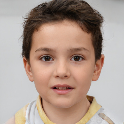 Joyful white child male with short  brown hair and brown eyes