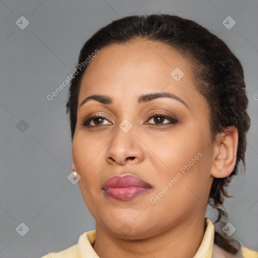 Joyful latino young-adult female with medium  brown hair and brown eyes