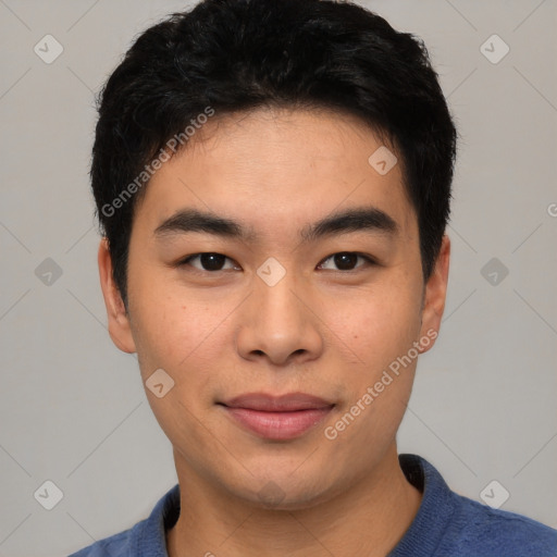 Joyful asian young-adult male with short  black hair and brown eyes